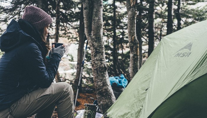 Motorbike rider camping after a tour