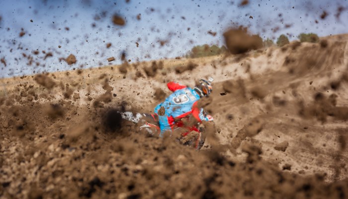 Motocross rider spraying dirt