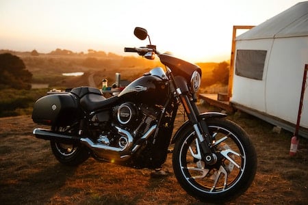 Harley davidson motorcycle against a setting sun