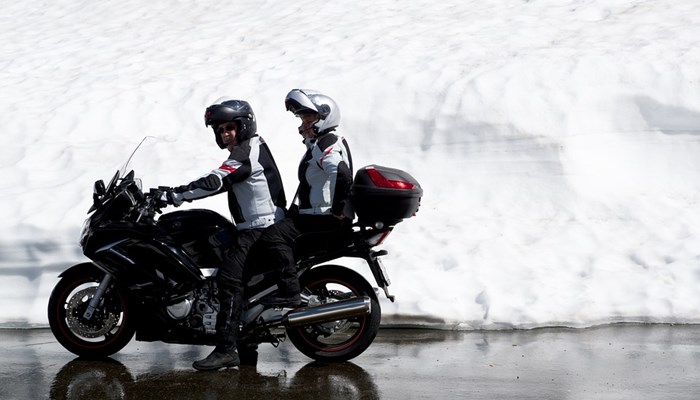 Pillion and rider on a motorbike